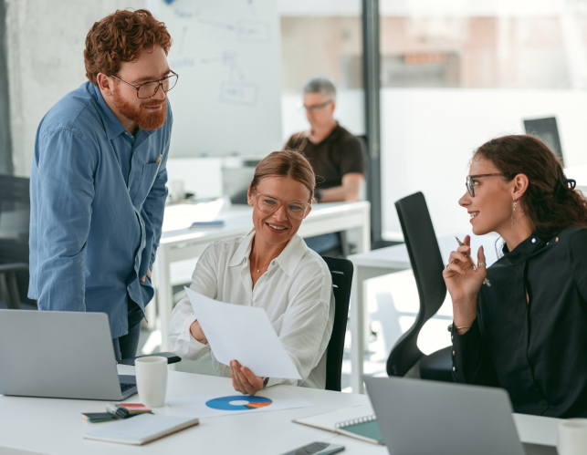 creative-business-team-working-project-modern-office-with-panoramic-view 1 (4) Team sharing ideas